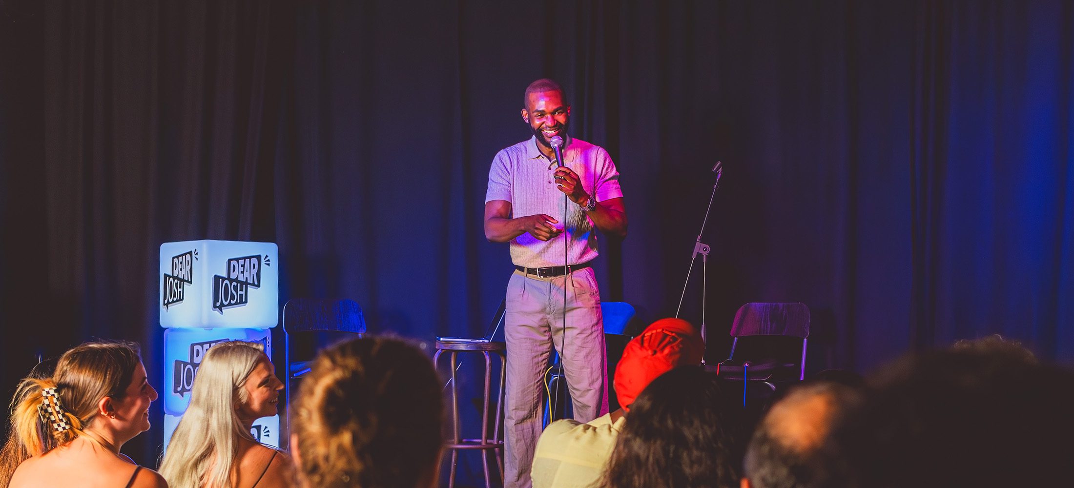 Comedian Verónica interacting with the audience after delivering a punchline during the Dear Josh Comedy Show at La Off Barcelona.