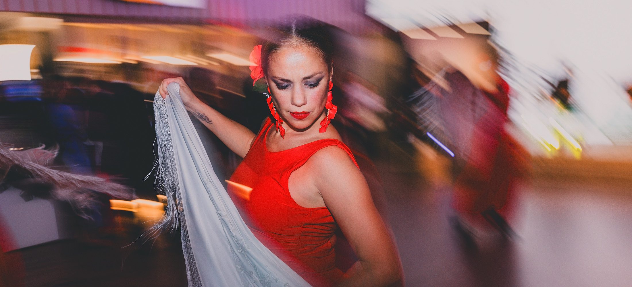 Flamenco dancer performing during a private event at Port Vell in Barcelona, photographed with creative motion blur.