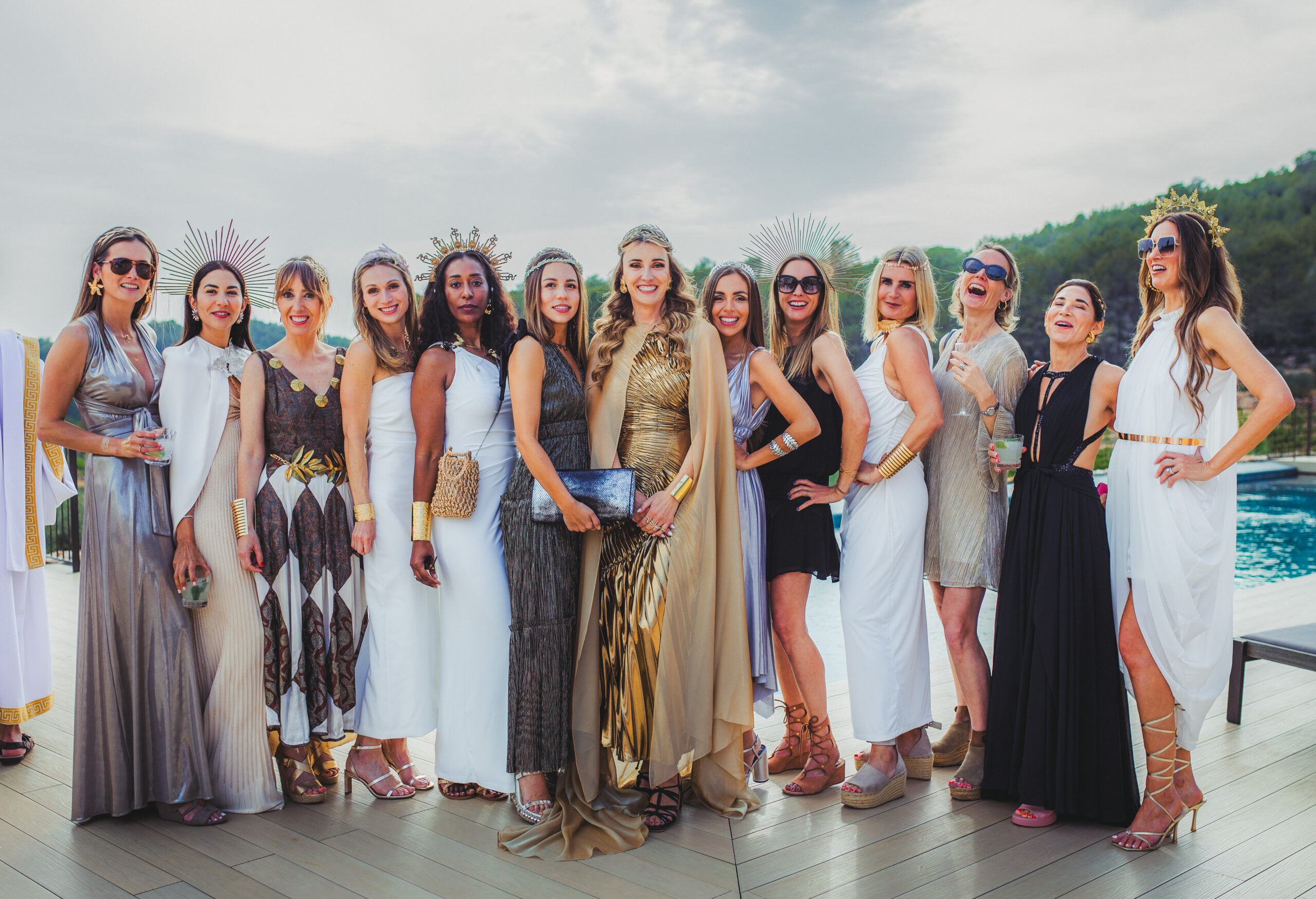 Guests dressed in Greek-inspired attire during a luxury birthday celebration at Masia Cabellut in Tarragona.