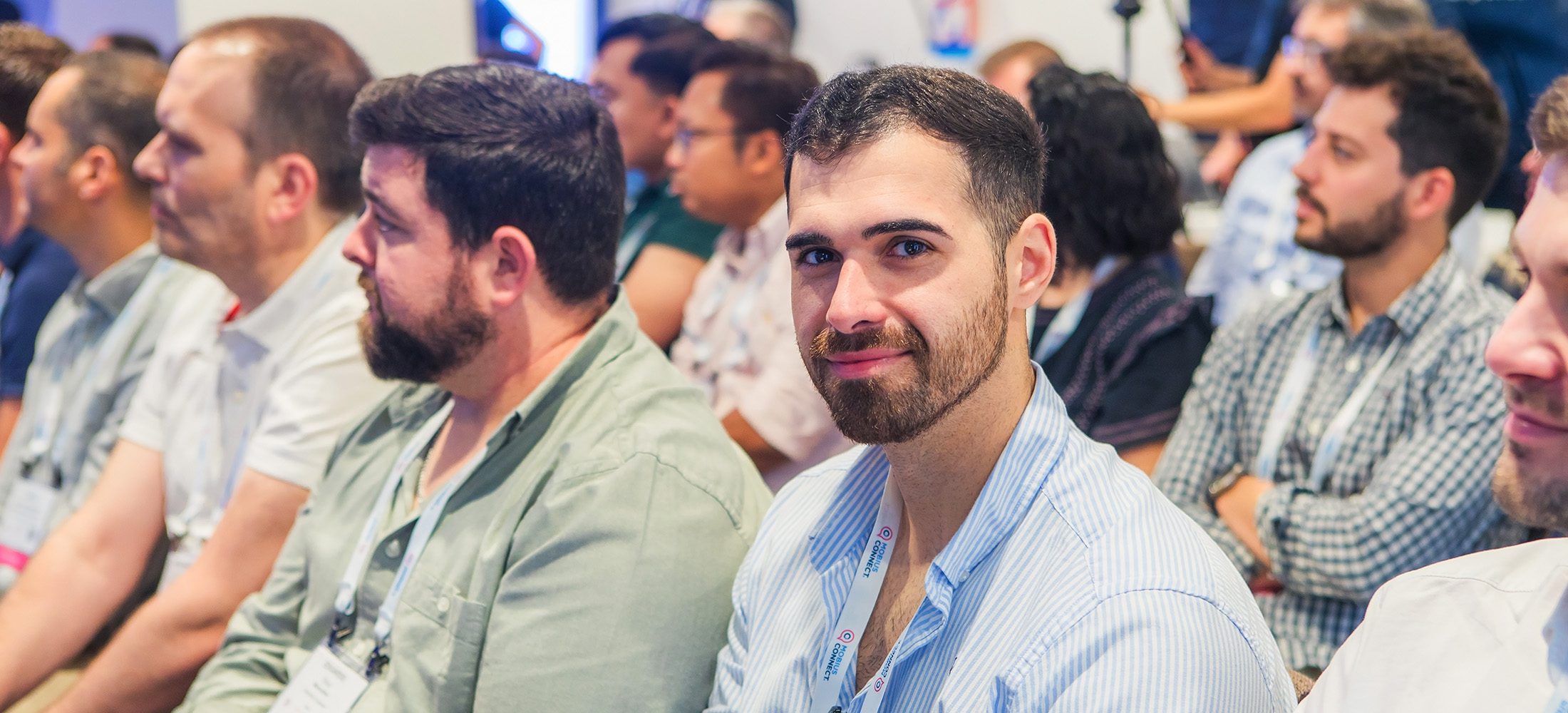 Conference attendee listening during a Mobius training session at Sofitel Barcelona.